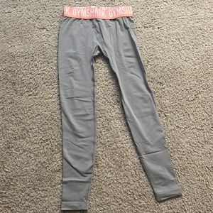 Grey Gymshark leggings with peach band